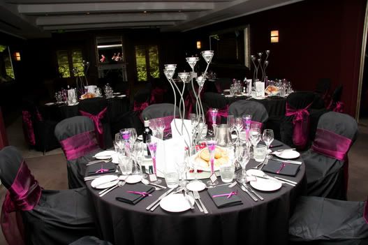 We had black table covers chair covers and napkins with purple pink sashes 