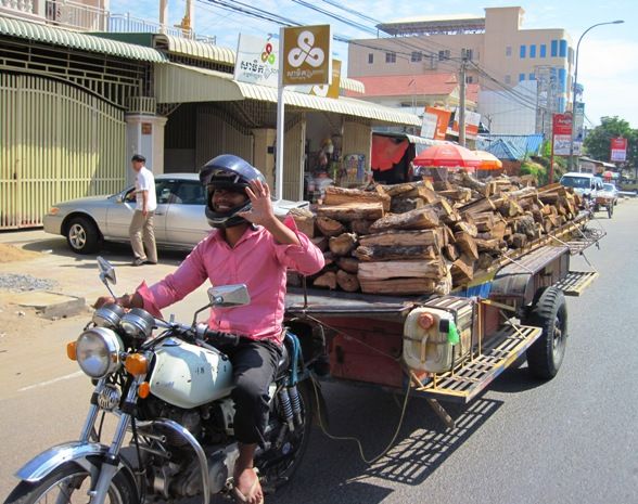 9-Scooters-are-put-to-a-1000-and-1-uses-here-This-one-was-hooked-up-to-a-trailer-and-deliverying-firewood_zpse38f6a1d.jpg