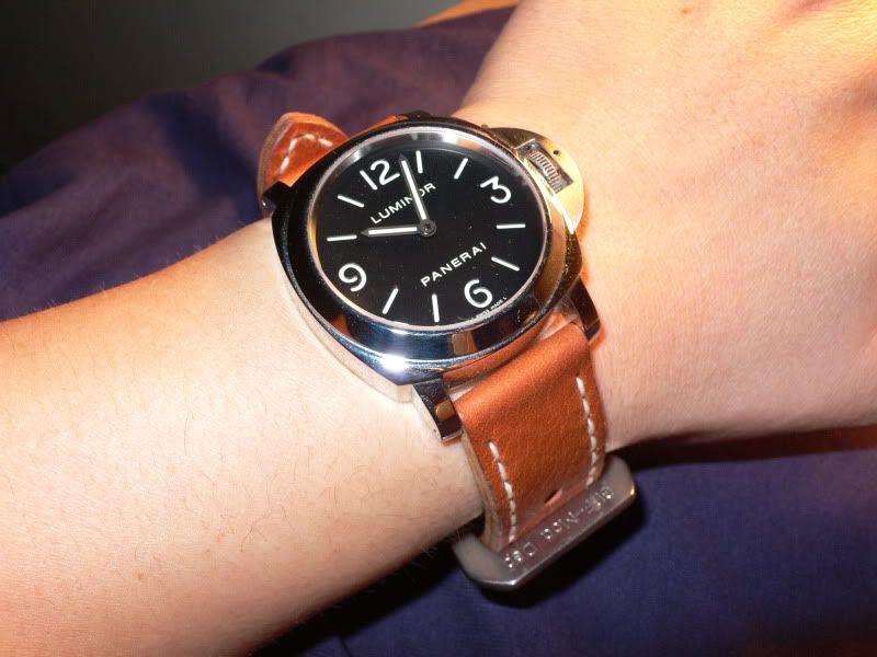 black watch face brown strap